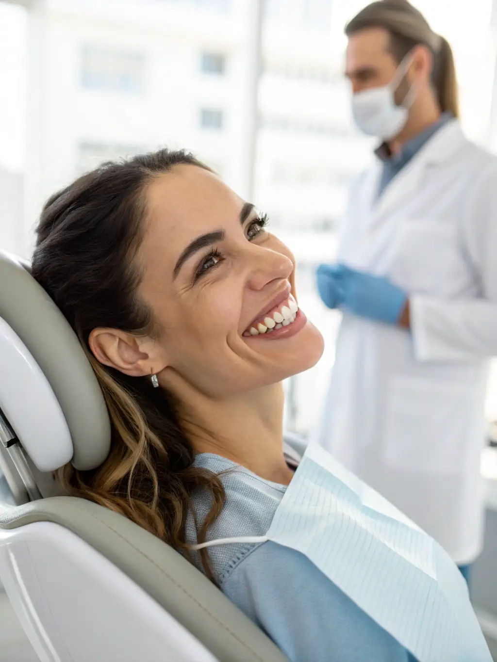 A patient smiling confidently after receiving cosmetic dental treatment, showcasing the transformative results at Honest Tooth Family Dentistry.