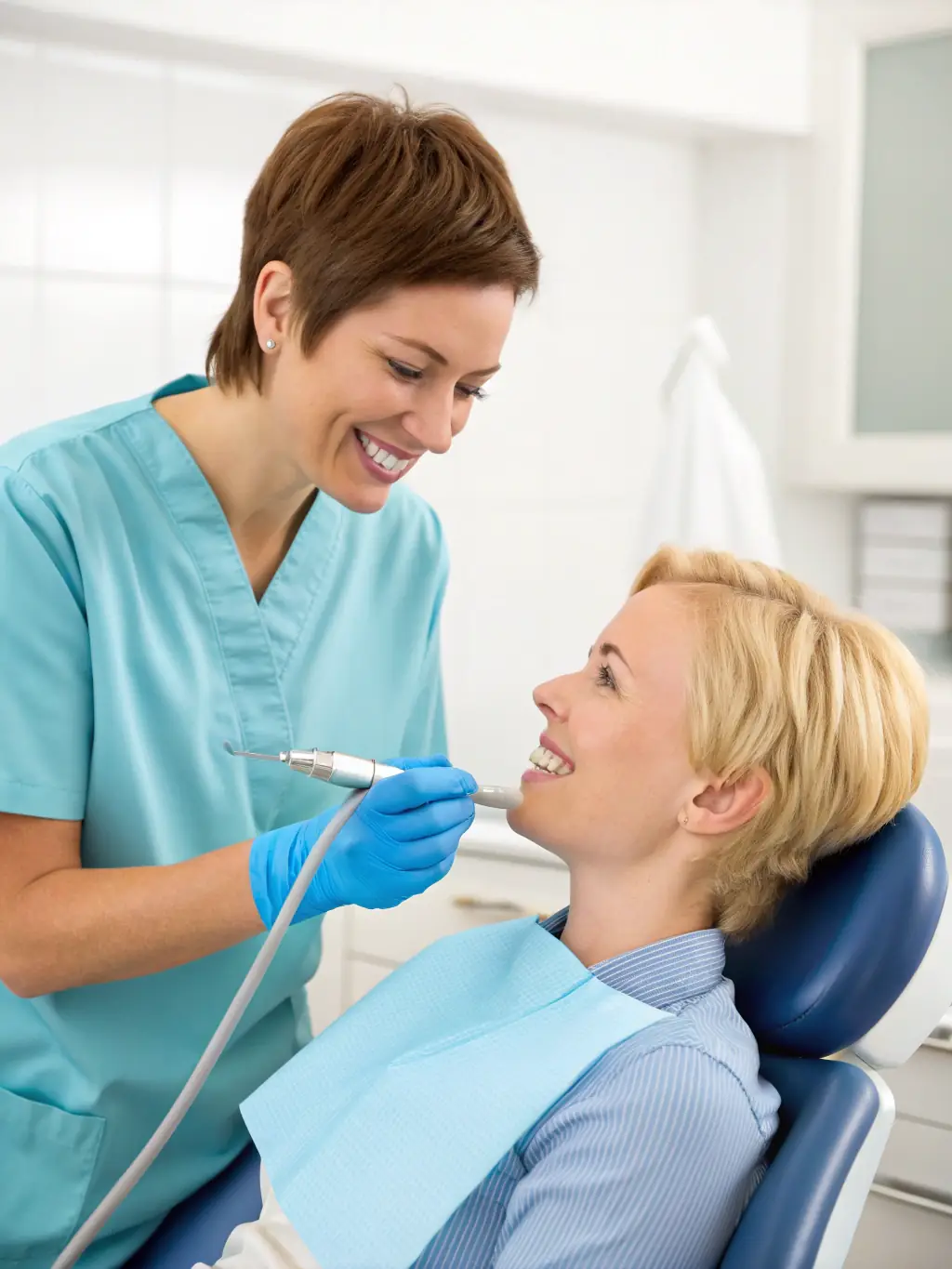 A dental hygienist demonstrating proper brushing techniques to a patient, emphasizing the importance of oral hygiene at Honest Tooth Family Dentistry.